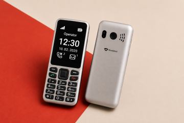 BlindShell Classic Lite shown from the front and back on a contrasting red and warm cream background. The front view highlights the large high-contrast screen, tactile physical keypad, navigation and call buttons, while the back view shows the BlindShell logo.